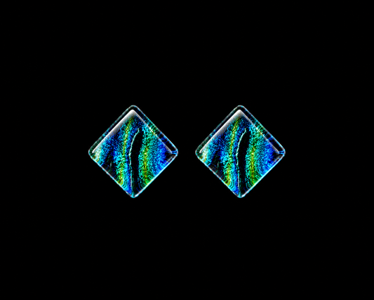 A pair of round diamond-shaped stud earrings with a vibrant, iridescent rainbow pattern of blue, green, and yellow on a black background.