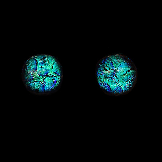 Two round cabochon gemstones with vibrant blue, green, and purple iridescent opal patterns, displayed side-by-side on a solid black background.
