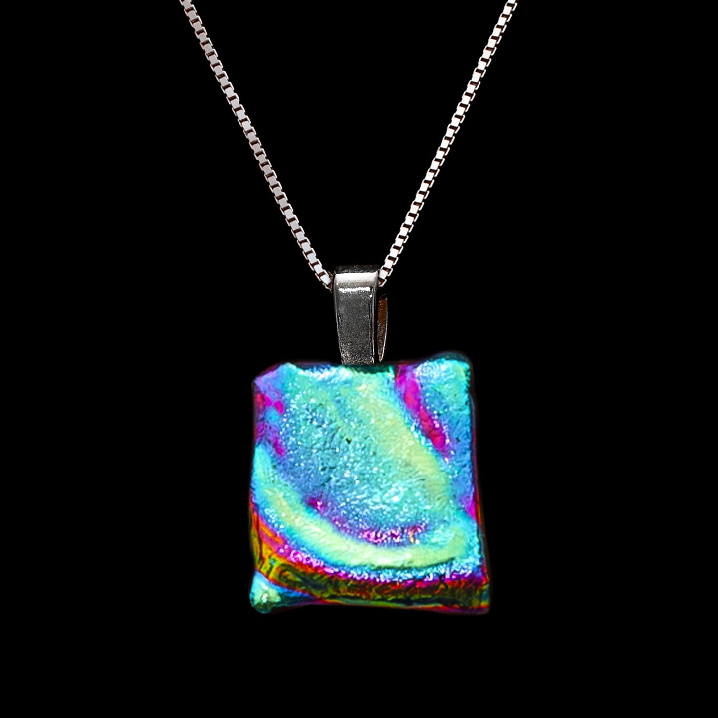 Colorful rectangular pendant on a black background